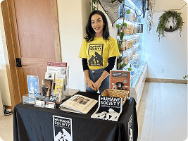 Volunteer at a table display